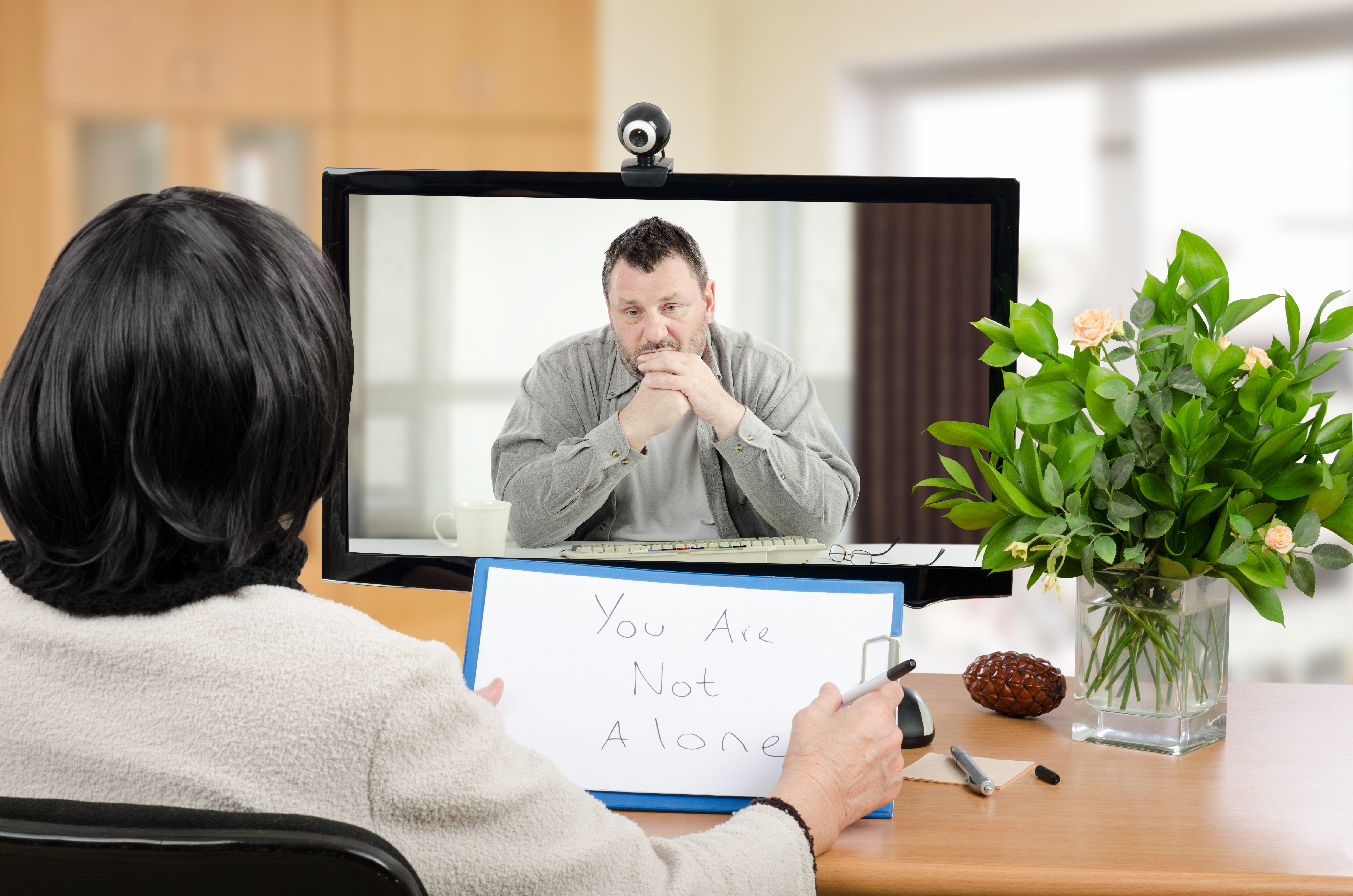 Middle,Aged,Man,Sitting,In,The,Monitor,Talks,With,Psychotherapist